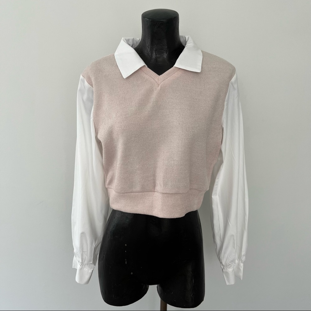 Cream sweater vest with white blouse
